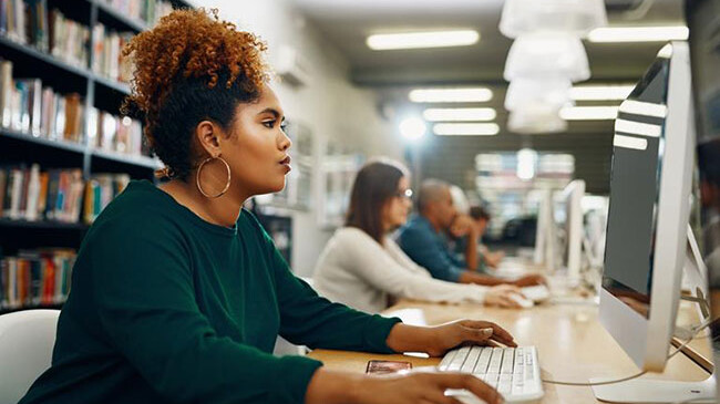 Female using a desktop computer