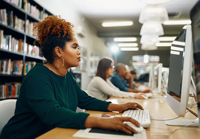 Female using a desktop computer