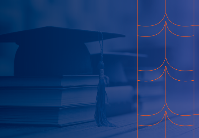 A graduation cap on top of a stack of books with an blue overlay to mute the colors
